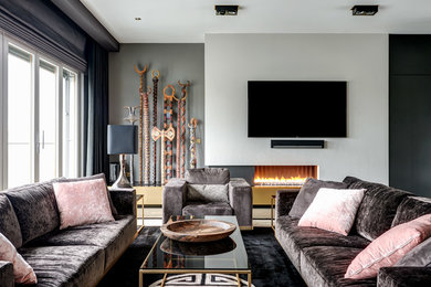 Photo of a medium sized contemporary enclosed living room in Berlin with carpet, a ribbon fireplace, a plastered fireplace surround, a wall mounted tv and black floors.