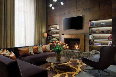 This is an example of a contemporary games room in London with a ribbon fireplace, a wall mounted tv and wood walls.