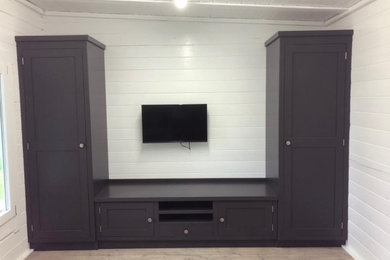 Photo of a modern games room in Kent with a wall mounted tv.