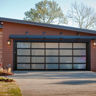 Inspiration for a large modern attached two-car garage remodel in Philadelphia