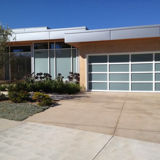 Large trendy attached two-car garage photo in Los Angeles