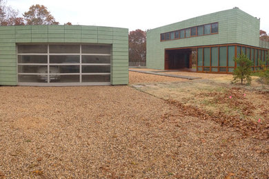 Inspiration for a large modern detached two-car carport remodel in New York