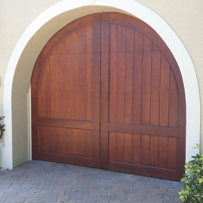 Mid-sized island style attached one-car garage photo in Miami