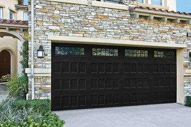 Example of a mid-sized classic attached two-car garage design in Orange County