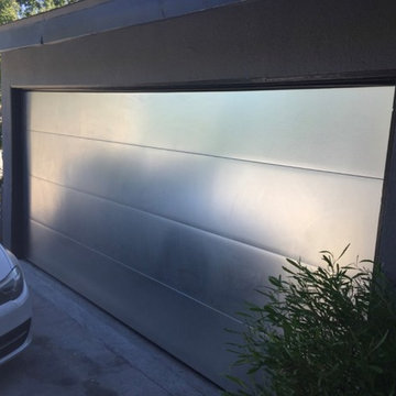 Brushed aluminum sectional roll up garage door