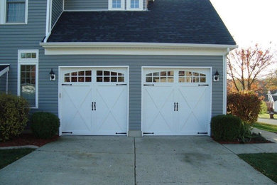 Example of a large classic attached two-car garage design in Cleveland