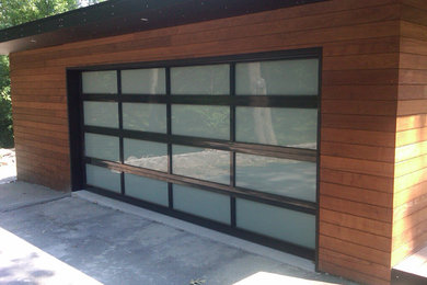 Garage - mid-sized contemporary attached two-car garage idea in Cleveland