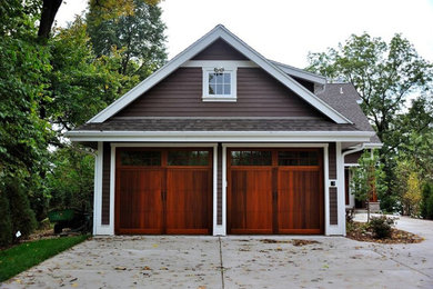Mid-sized elegant attached two-car garage photo in Cleveland