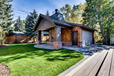 Example of a small classic detached two-car garage design in Calgary