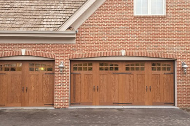 Inspiration for a large craftsman attached three-car carport remodel in Chicago