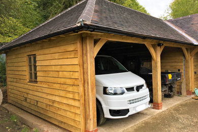 Design ideas for a large farmhouse detached carport in West Midlands with four or more cars.
