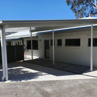Example of a small trendy detached two-car carport design in Sunshine Coast