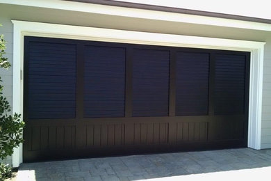 Garage - mid-sized coastal attached two-car garage idea in Orange County