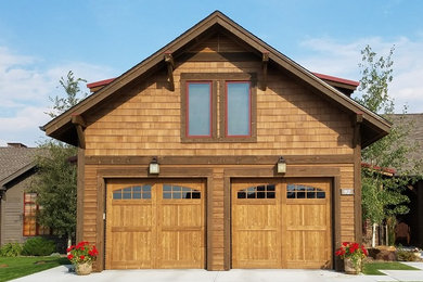 Inspiration for a mid-sized timeless attached three-car garage remodel in Other