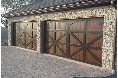 Inspiration for a large rustic attached garage in Austin with four or more cars.