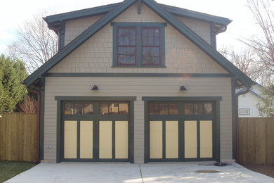 Example of a mid-sized arts and crafts detached two-car garage workshop design in Baltimore