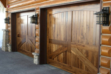 Mid-sized mountain style attached three-car garage photo in Other