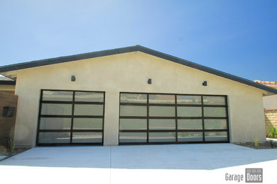 Example of a mid-sized minimalist attached two-car carport design in San Diego