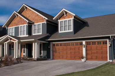 Medium sized traditional attached garage in Other with three or more cars.