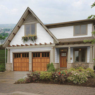 Mid-sized arts and crafts attached two-car garage photo in Cincinnati