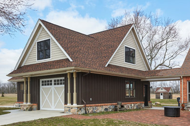 Garage - large farmhouse detached one-car garage idea in Grand Rapids
