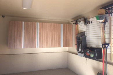 Mid-sized elegant attached two-car garage workshop photo in Salt Lake City