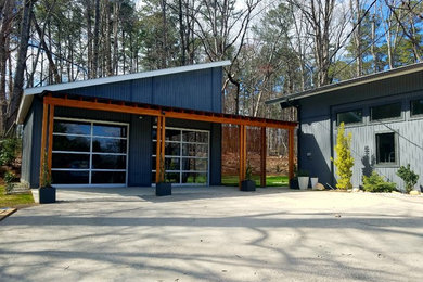 Example of a mid-sized trendy two-car garage design in Raleigh