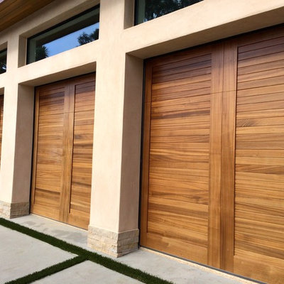 Inspiration for a large tropical attached three-car carport remodel in Orange County