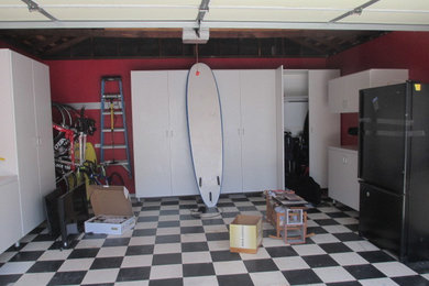 Inspiration for a mid-sized contemporary attached two-car garage remodel in Los Angeles