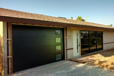 Photo of a medium sized contemporary attached single garage in Phoenix.