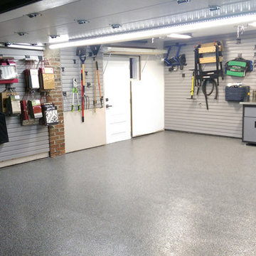 Etobicoke custom garage with epoxy floor, slat walls & cabinets