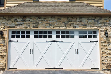 Garage - mid-sized rustic attached two-car garage idea