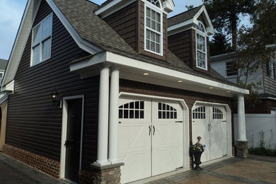 Mid-sized elegant detached two-car garage photo in Other