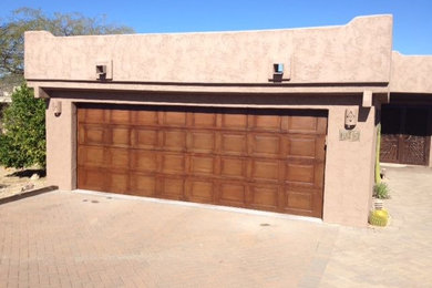 Inspiration for a large craftsman attached two-car garage remodel in Phoenix