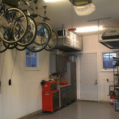 Garage workshop - mid-sized transitional attached two-car garage workshop idea in Denver