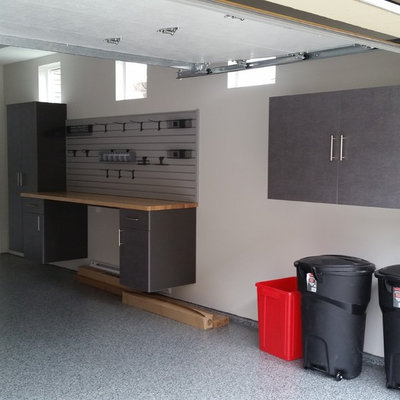 Garage - mid-sized industrial attached one-car garage idea in Vancouver