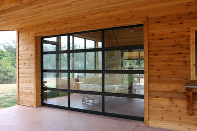 Photo of a medium sized contemporary attached garage workshop in Austin.