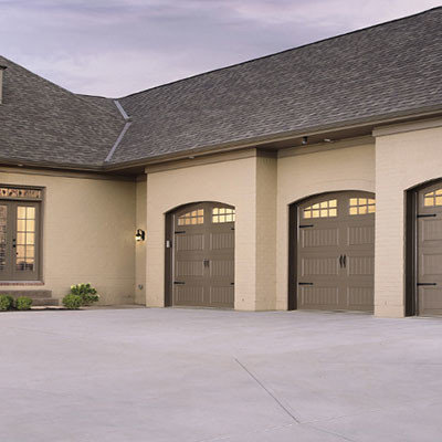 Mid-sized transitional attached three-car carport photo in Vancouver