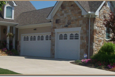 Large attached three-car garage photo in Cleveland