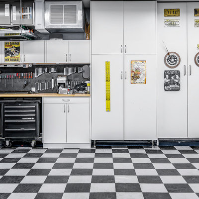 Inspiration for a large contemporary attached garage workshop remodel in New York