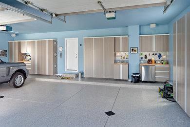 Example of a mid-sized transitional two-car garage workshop design in Cleveland