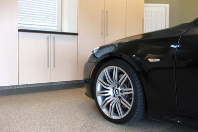 Example of a mid-sized transitional attached two-car garage design in Cleveland