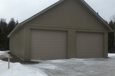 Large detached two-car garage photo in Other