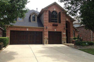 Inspiration for a large attached three-car garage remodel in Dallas