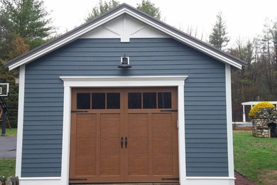 Photo of a traditional detached single garage in Boston.