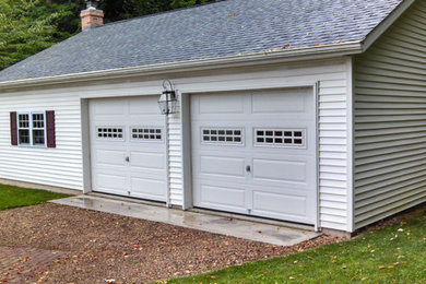 Garage workshop - mid-sized traditional detached two-car garage workshop idea in Cleveland