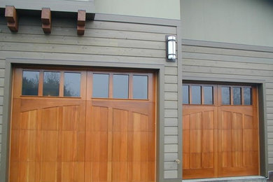 Garage - mid-sized craftsman attached two-car garage idea in Other