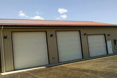 Example of a large cottage garage design in Other