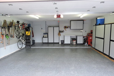 Inspiration for a mid-sized transitional attached two-car garage workshop remodel in Dallas