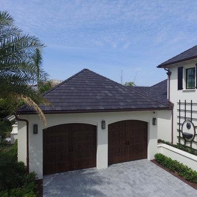 Huge beach style attached two-car carport photo in Miami